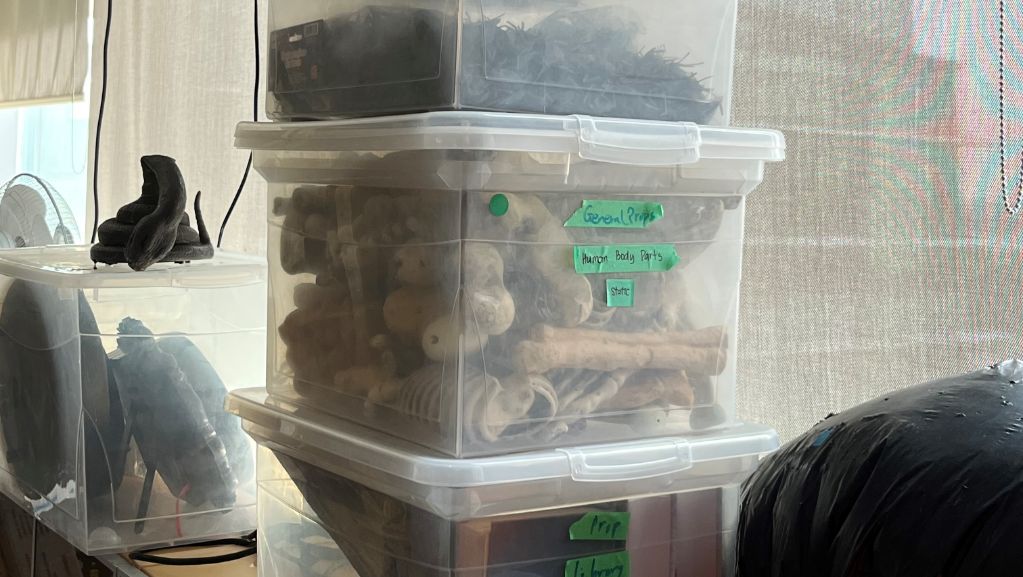 Bin of plastic bones, misc.