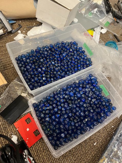 Bin of blue glass beads