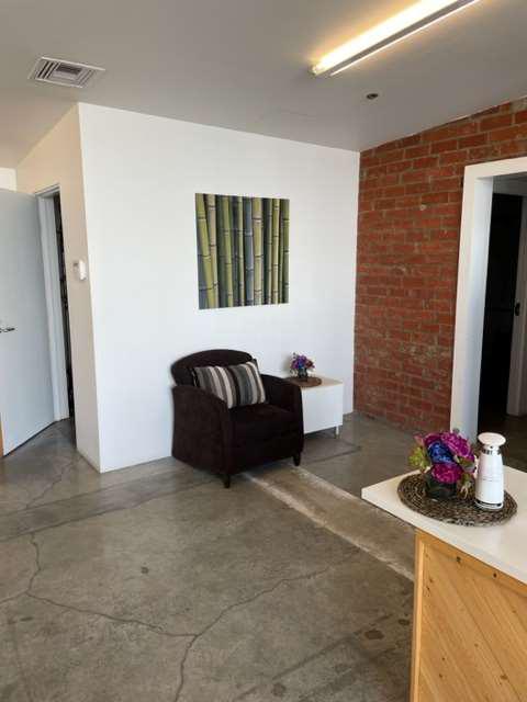 Brown Lounge Chairs with Pillows