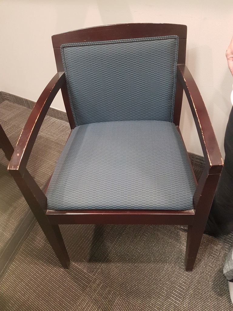 Wood guest chair with grey upholstering