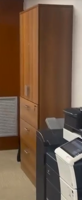 Tall wooden storage cabinet