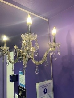 Crystal, wall-mounted chandelier