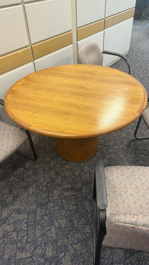 Round meeting table with wooden yellow top for four people