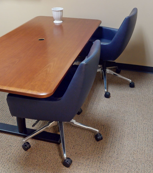Blue chair with arms on rollers
