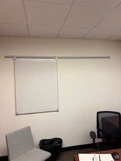 Wall-mounted modular whiteboards