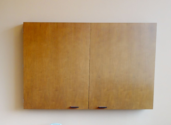 Mounted whiteboard in cabinet