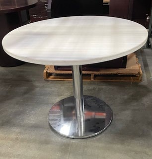 White round table with chrome base