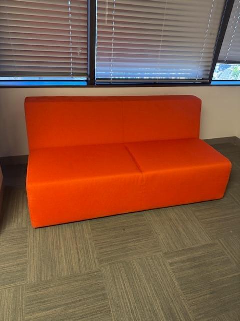 ORANGE ARMLESS COUCH