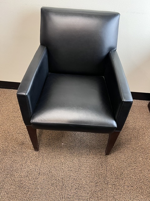 Black leather guest chairs