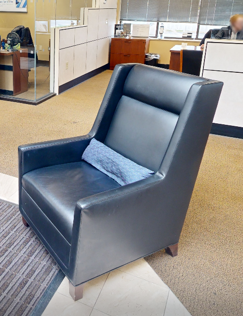 Black tall-back lounge chair