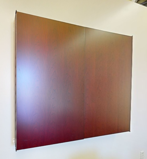 Whiteboard in wall-mounted cabinet
