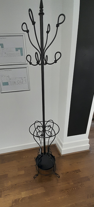 Black metal ornate coat stand