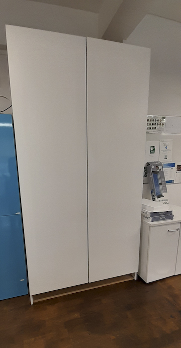 Tall white storewall cupboards