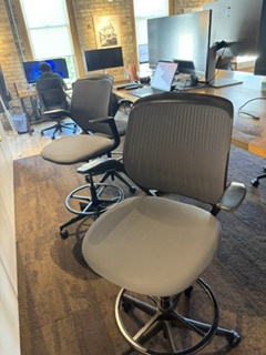 Black and gray high steel case chair