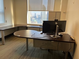 [#E8-29] Private offices with pea top desks and L shaped desks by the walls 