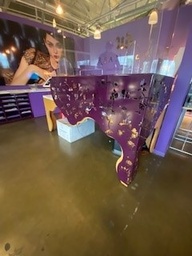 [#E5-193] Brown reception desk with purple metal accents